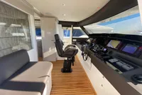 Luxurious 2016 Custom Line Navetta 28 yacht helm with modern navigation equipment and seating.