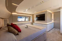 Luxurious bedroom interior of 2016 Custom Line Navetta 28 yacht with modern design and large windows.