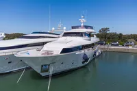 Luxurious 2016 Custom Line Navetta 28 yacht docked in a serene marina.