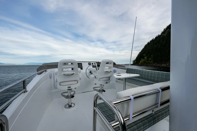 New Boat Hull #12 Yacht Photos Pics 2024 Nordic Tug 40 boat deck with seating and ocean view.