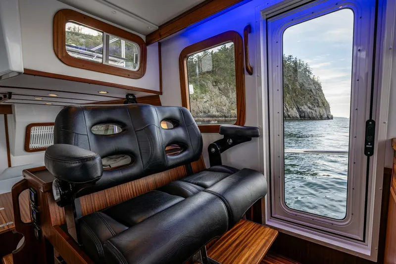 New Boat Hull #12 Yacht Photos Pics Interior of 2024 Nordic Tug 40 with ocean view through windows.