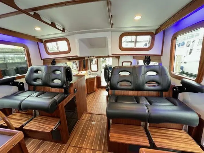 New Boat Hull #12 Yacht Photos Pics Interior of 2024 Nordic Tug 40 with luxurious seating and wood accents.