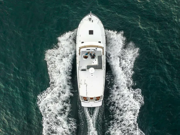 New Boat Hull #12 Yacht Photos Pics Aerial view of 2024 Nordic Tug 40 cruising on open water.