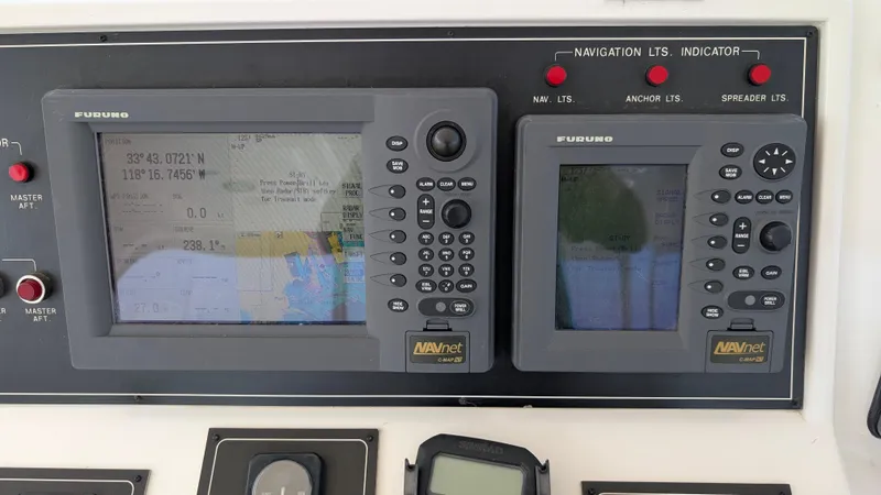 Odeesea Yacht Photos Pics Navigation equipment on a 2004 Johnson Motor Yacht, featuring Furuno displays and controls.