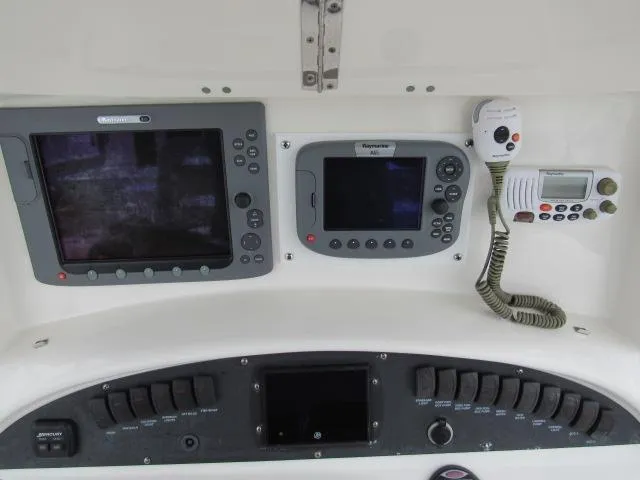 No Name Yacht Photos Pics 2006 Boston Whaler 32 Outrage Cuddy dashboard with navigation and communication equipment.