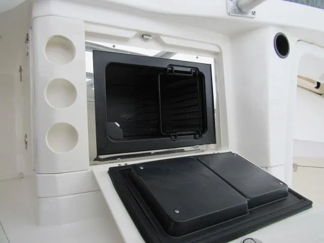No Name Yacht Photos Pics 2006 Boston Whaler 32 Outrage Cuddy storage compartment with open hatch.