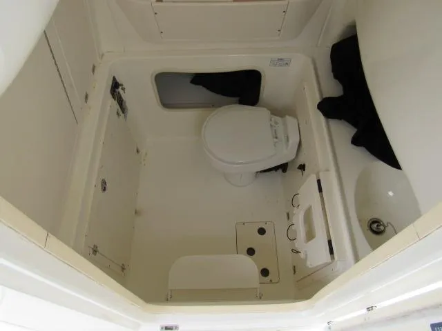 No Name Yacht Photos Pics 2006 Boston Whaler 32 Outrage Cuddy bathroom interior with toilet and sink.
