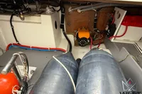 Engine room of 2017 Beneteau Swift Trawler 30 with visible wiring and equipment.