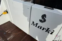 2017 Beneteau Swift Trawler 30, deck view with "Marki" name and logo.