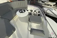 2017 Beneteau Swift Trawler 30 flybridge with seating and helm station.