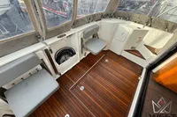2017 Beneteau Swift Trawler 30 cockpit with wooden flooring and seating.