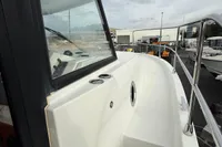 2017 Beneteau Swift Trawler 30, side deck view with railing and window.