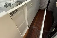 2017 Beneteau Swift Trawler 30 with teak deck, docked at marina.