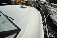 2017 Beneteau Swift Trawler 30 deck view with railing and hatch.
