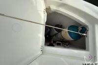 Storage compartment on 2017 Beneteau Swift Trawler 30 with equipment and rope.