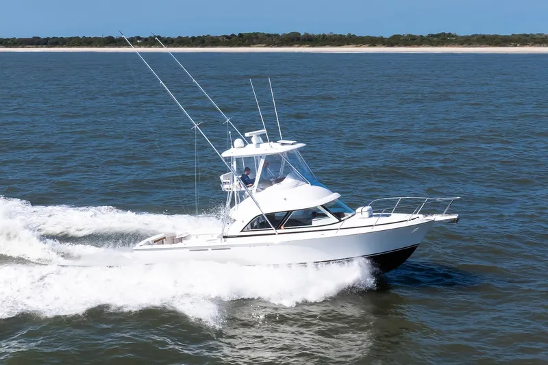 One More Yacht Photos Pics 2018 Bertram 35 Flybridge Sportfish cruising on open water.