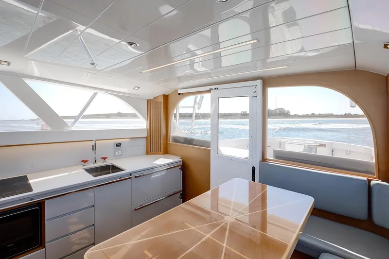 One More Yacht Photos Pics Interior of 2018 Bertram 35 Flybridge Sportfish yacht with modern kitchen and ocean view.