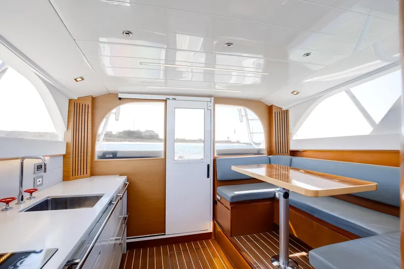 One More Yacht Photos Pics Interior of 2018 Bertram 35 Flybridge Sportfish with modern kitchen and dining area.