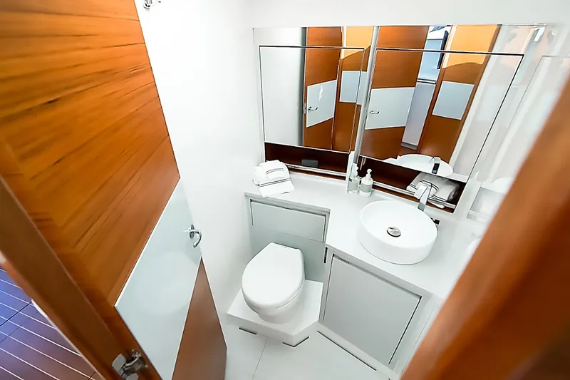 One More Yacht Photos Pics Luxurious bathroom in 2018 Bertram 35 Flybridge Sportfish yacht, featuring modern fixtures and elegant design.