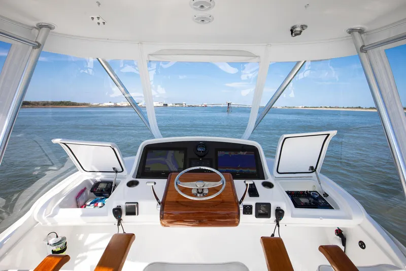 One More Yacht Photos Pics 2018 Bertram 35 Flybridge Sportfish helm with dual displays and ocean view.