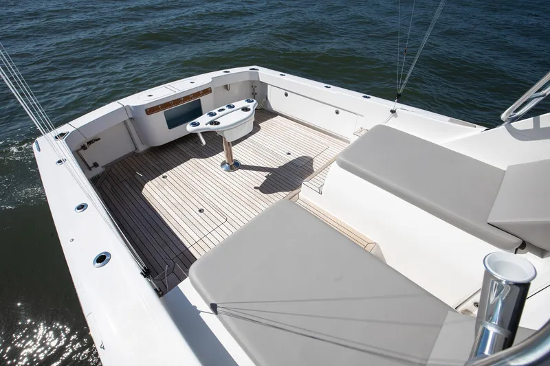 One More Yacht Photos Pics 2018 Bertram 35 Flybridge Sportfish boat deck with seating and ocean view.