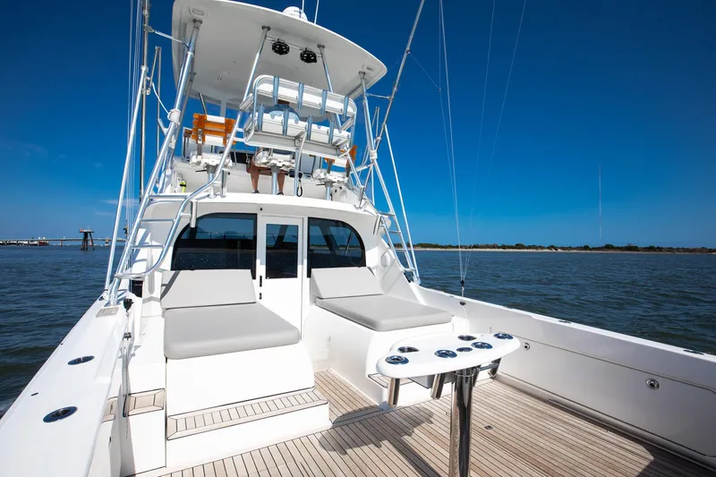 One More Yacht Photos Pics 2018 Bertram 35 Flybridge Sportfish boat on open water, featuring spacious deck and seating.