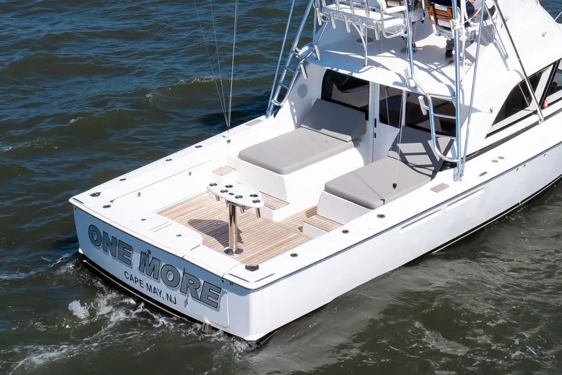 One More Yacht Photos Pics 2018 Bertram 35 Flybridge Sportfish boat on water, rear view, named "One More".