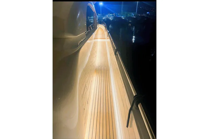  Yacht Photos Pics Side deck of 2000 Ferretti Yachts 72 at night, illuminated with ambient lighting.