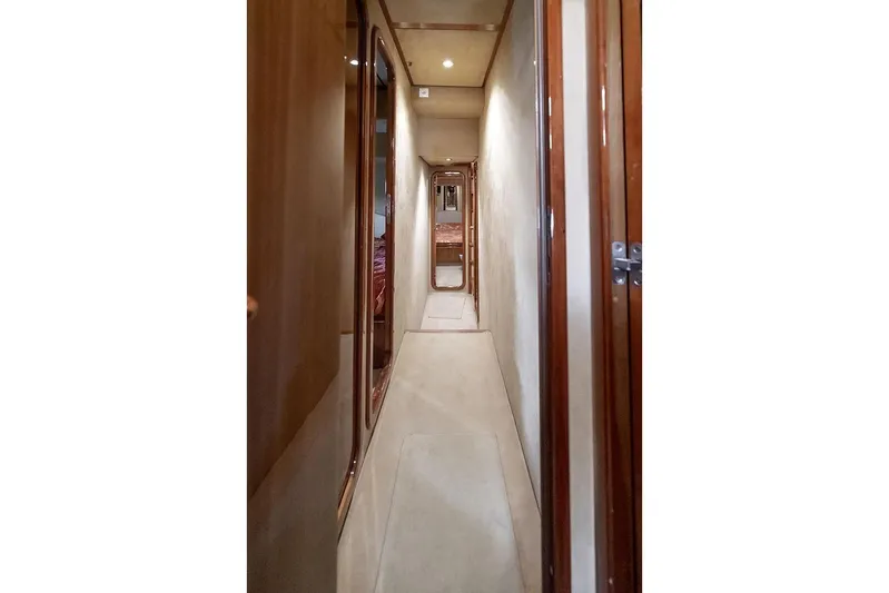  Yacht Photos Pics Hallway inside 2000 Ferretti Yachts 72, featuring elegant wood paneling and soft lighting.