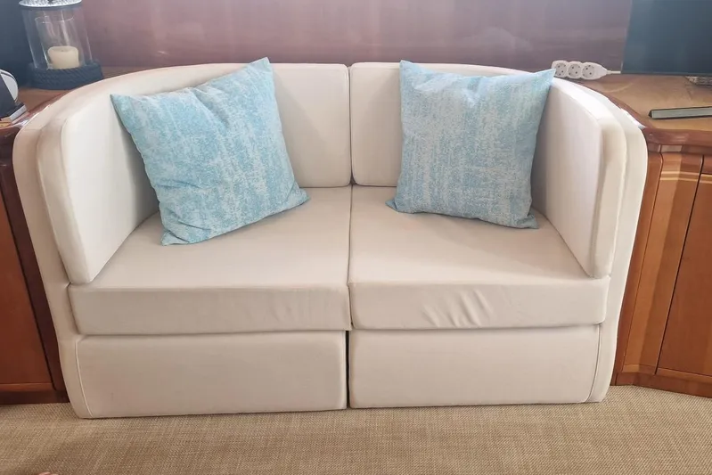  Yacht Photos Pics Cream sofa with blue cushions on a 2000 Ferretti Yachts 72.