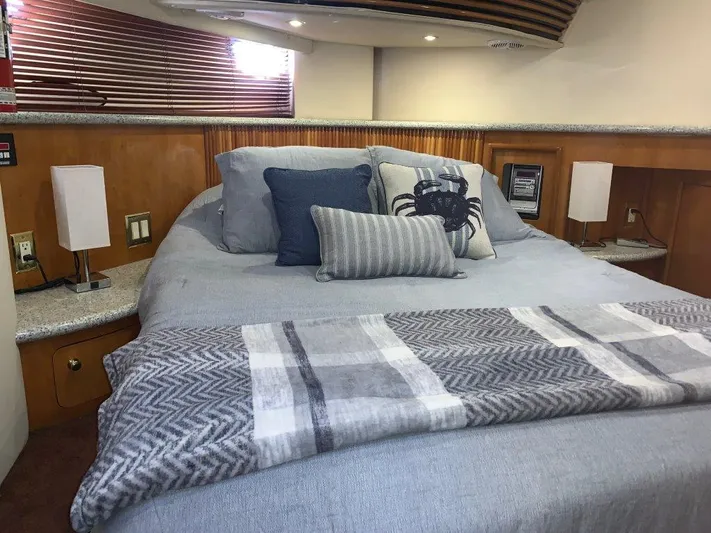  Yacht Photos Pics Luxurious bedroom interior of 2002 Carver 450 Voyager Pilothouse yacht with cozy bedding.