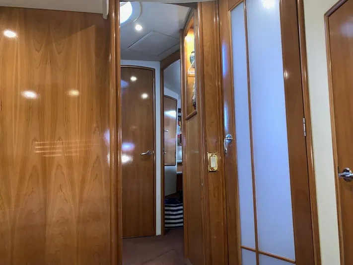  Yacht Photos Pics Interior of 2002 Carver 450 Voyager Pilothouse with wooden doors and modern lighting.