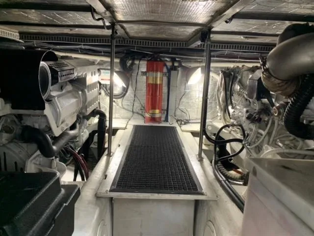  Yacht Photos Pics Engine room of 2002 Carver 450 Voyager Pilothouse with visible machinery and fire extinguisher.