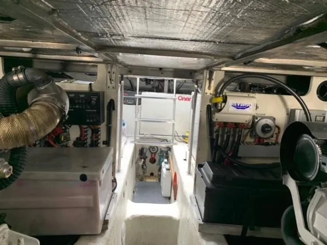  Yacht Photos Pics Engine room of 2002 Carver 450 Voyager Pilothouse with visible equipment and wiring.