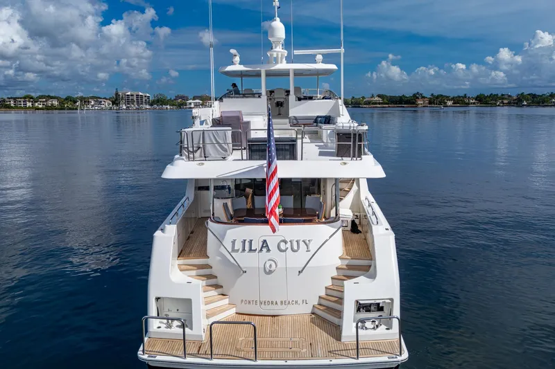 Lila Cuy Yacht Photos Pics Luxury yacht Westport 112, 2006 model, docked with scenic waterfront view.