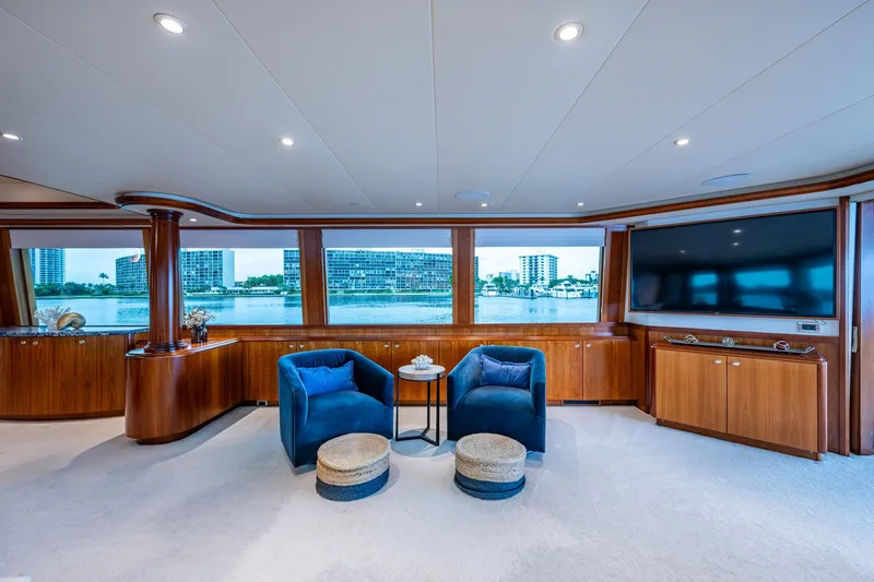 Lila Cuy Yacht Photos Pics Luxurious 2006 Westport 112 yacht interior with elegant seating, large windows, and waterfront view.