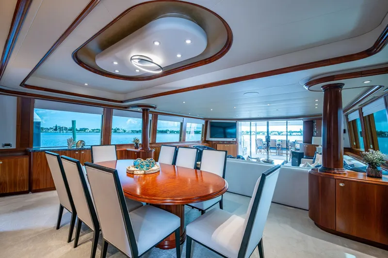 Lila Cuy Yacht Photos Pics Luxurious interior of 2006 Westport 112 yacht with elegant dining area and scenic views.