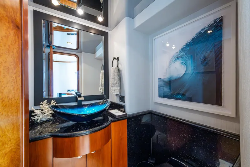 Lila Cuy Yacht Photos Pics Luxurious bathroom on 2006 Westport 112 yacht with modern sink and ocean wave artwork.