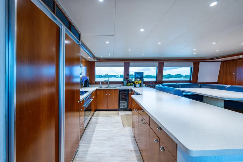 Lila Cuy Yacht Photos Pics Luxurious kitchen interior of 2006 Westport 112 yacht with modern amenities and panoramic windows.