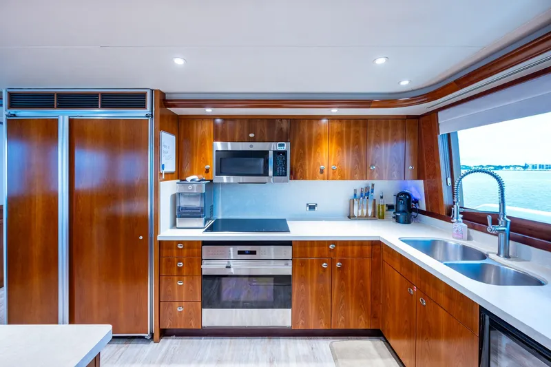 Lila Cuy Yacht Photos Pics Luxurious kitchen interior on 2006 Westport 112 yacht with modern appliances and ocean view.