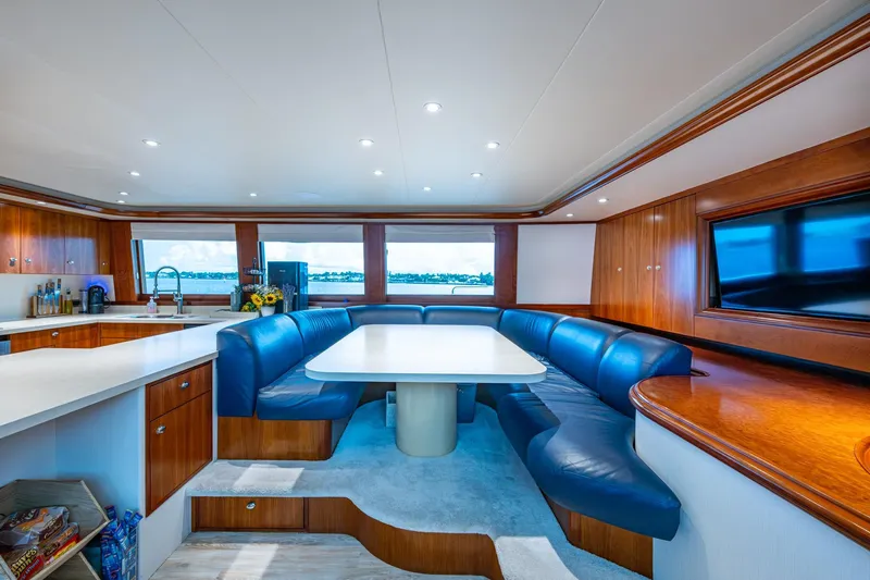 Lila Cuy Yacht Photos Pics Luxurious 2006 Westport 112 yacht interior with elegant dining area and modern kitchen.