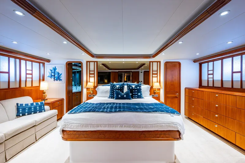 Lila Cuy Yacht Photos Pics Luxurious 2006 Westport 112 yacht bedroom with elegant wood finishes and modern decor.