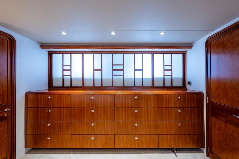 Lila Cuy Yacht Photos Pics Luxurious wooden cabinetry on 2006 Westport 112 yacht interior, featuring elegant design and lighting.