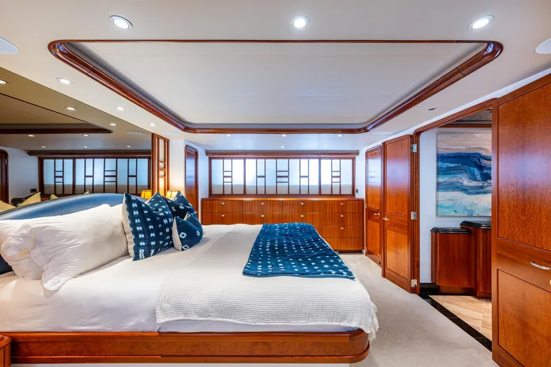 Lila Cuy Yacht Photos Pics Luxurious 2006 Westport 112 yacht bedroom with elegant wood finishes and modern decor.