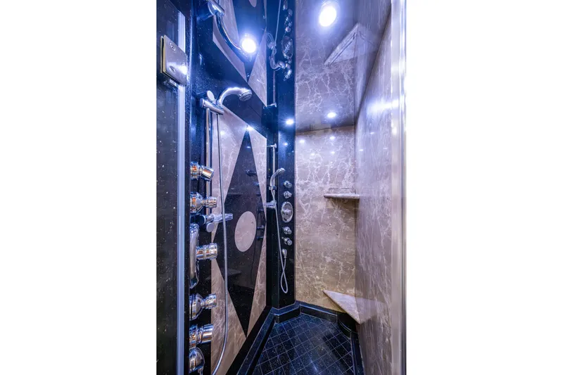 Lila Cuy Yacht Photos Pics Luxurious marble shower interior with modern fixtures in a 2006 Westport 112 yacht.