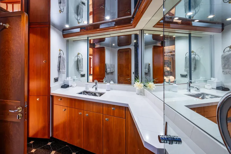 Lila Cuy Yacht Photos Pics Luxurious bathroom in 2006 Westport 112 yacht with wooden cabinetry and mirrored walls.