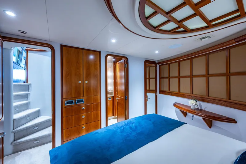 Lila Cuy Yacht Photos Pics Luxurious 2006 Westport 112 yacht bedroom with elegant wood finishes and modern design.