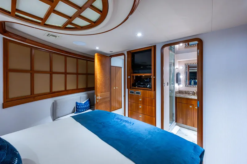 Lila Cuy Yacht Photos Pics Luxurious bedroom interior on 2006 Westport 112 yacht with wood accents and ensuite bathroom.