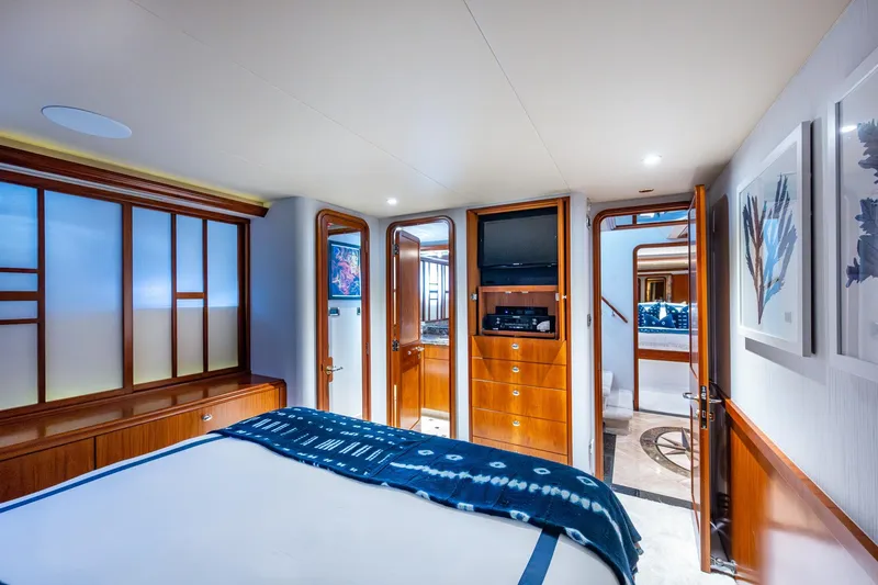 Lila Cuy Yacht Photos Pics Luxurious 2006 Westport 112 yacht bedroom with elegant wood finishes and modern decor.