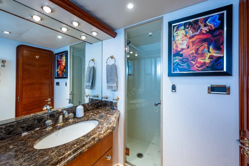 Lila Cuy Yacht Photos Pics Luxurious bathroom on 2006 Westport 112 yacht with marble countertop and abstract art.